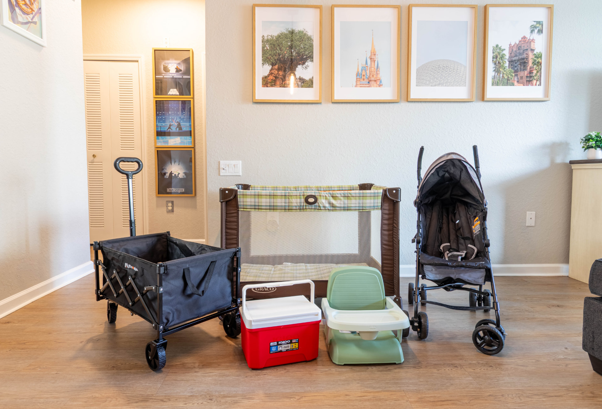 Baby gear included free with your stay — pack 'n play crib, stroller, wagon, cooler, and booster seat