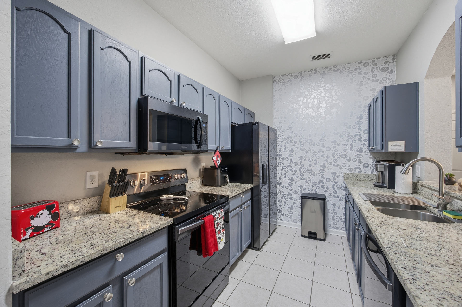 Kitchen with full-size appliances and granite counters