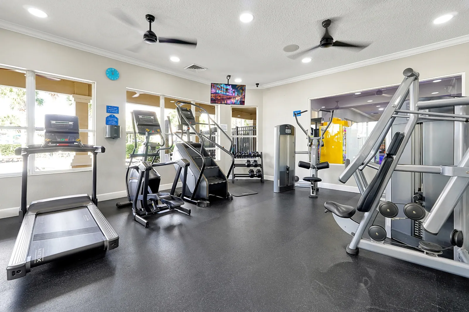 Fitness center with treadmill, elliptical, and weight machines
