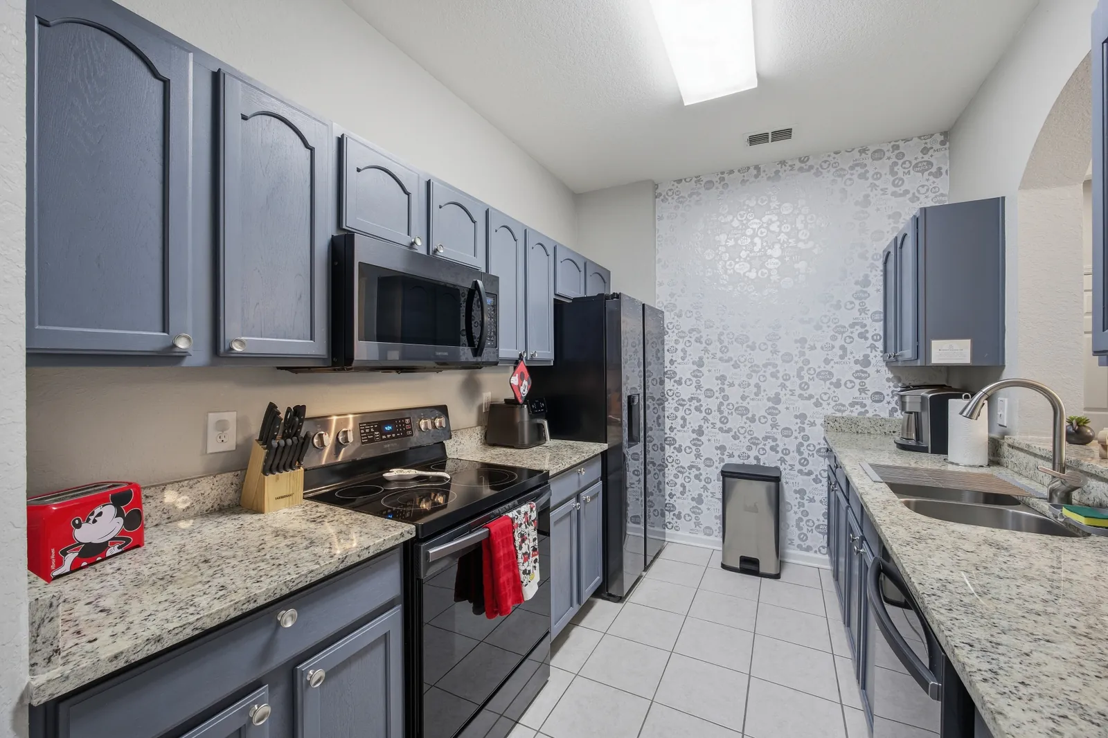 Kitchen with full-size appliances and granite counters