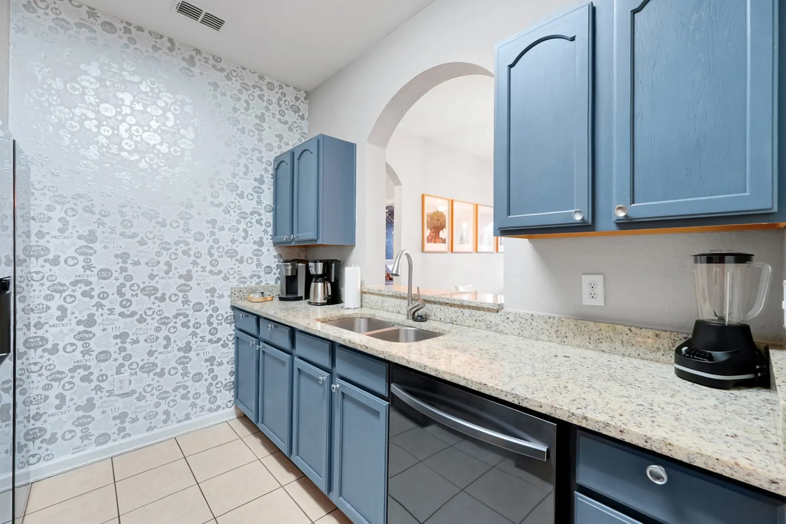 Kitchen with playful Mickey Mouse accent wallpaper