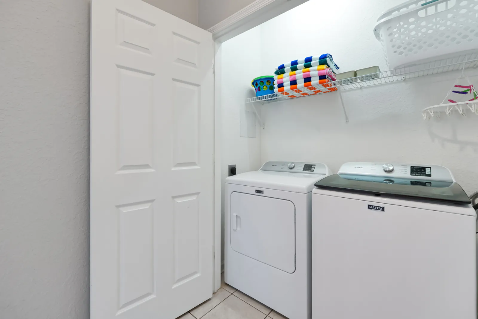In-unit laundry room with washer and dryer