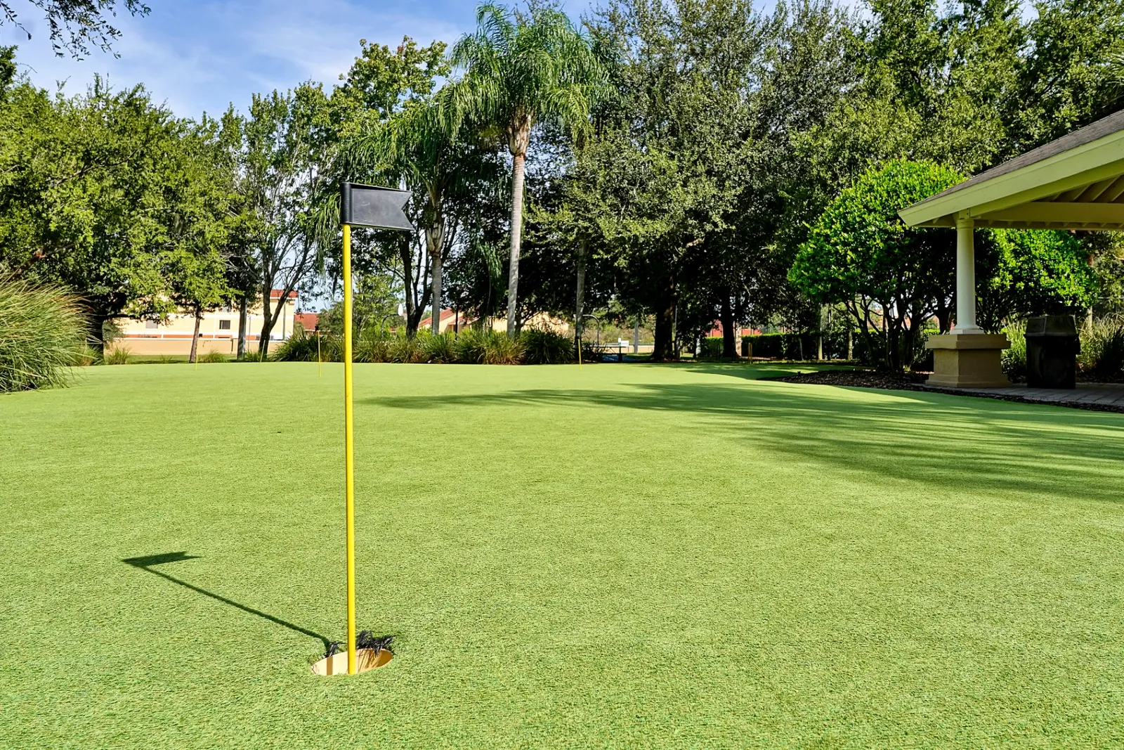 Resort putting green with flag and pavilion