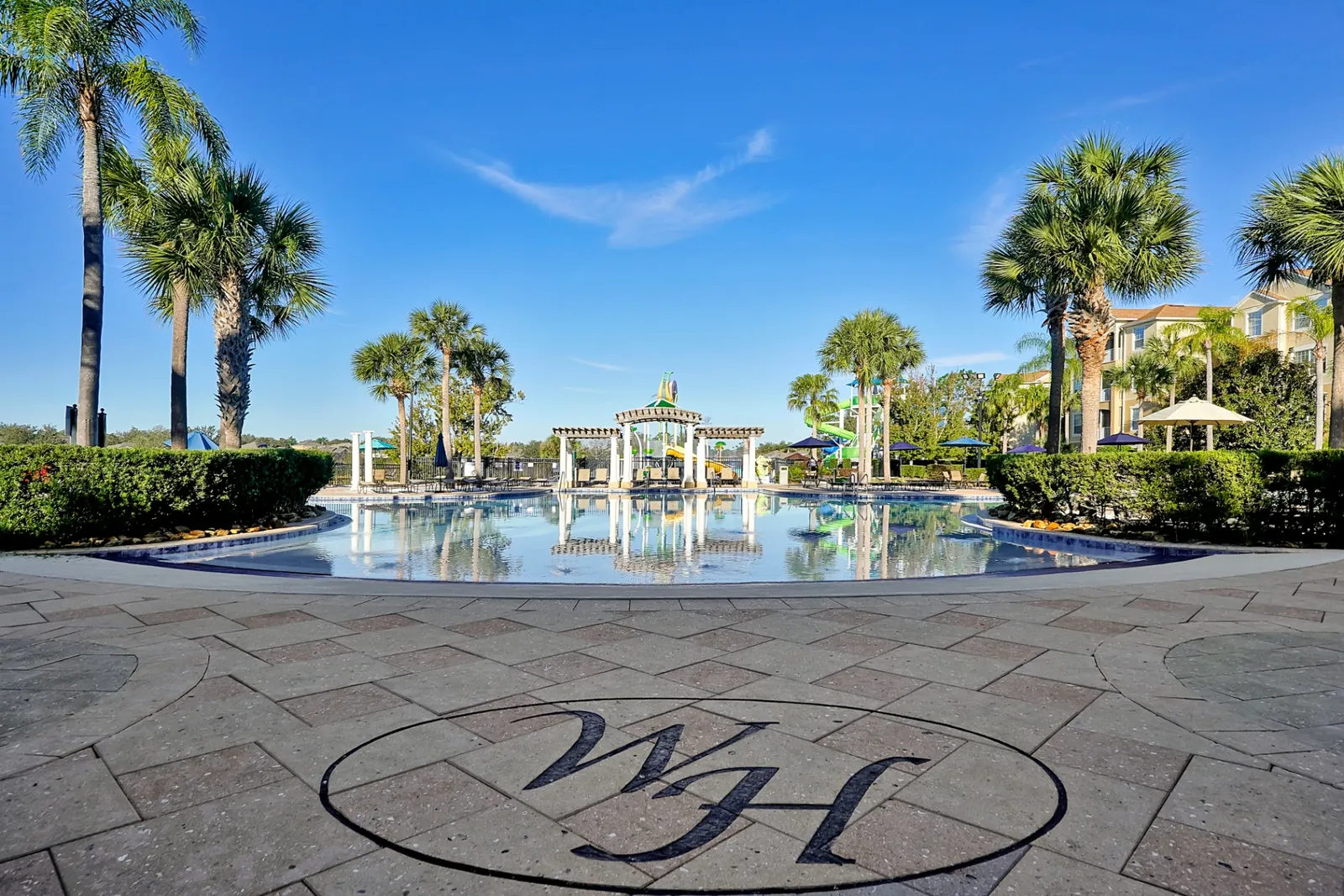 Resort pool with Windsor Hills monogram in foreground